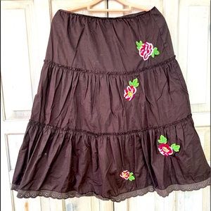 Cute dark brown prairie skirt with embroidered roses.